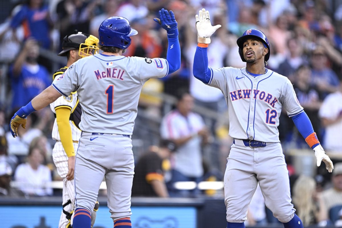 Aug 24, 2024; San Diego, California, USA; New York Mets shortstop Francisco Lindor (12) is congratulated by second baseman Jeff McNeil (1) after hitting a grand slam home run against the San Diego Padres during the fourth inning at Petco Park. Mandatory Credit: Orlando Ramirez-USA TODAY Sports