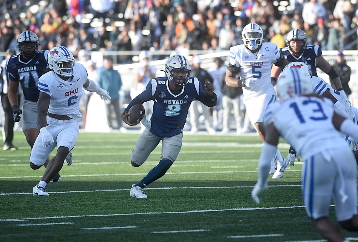 Nevada’s Brendon Lewis looks to run while taking on SMU at Mackay Stadium in Reno on Aug. 24, 2024.