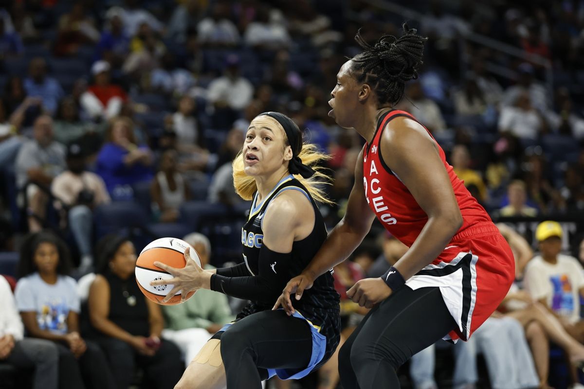 Aug 25, 2024; Chicago, Illinois, USA; Chicago Sky guard Chennedy Carter (7) drives to the basket against Las Vegas Aces guard Chelsea Gray (12) during the first half at Wintrust Arena. Mandatory Credit: Kamil Krzaczynski-USA TODAY Sports