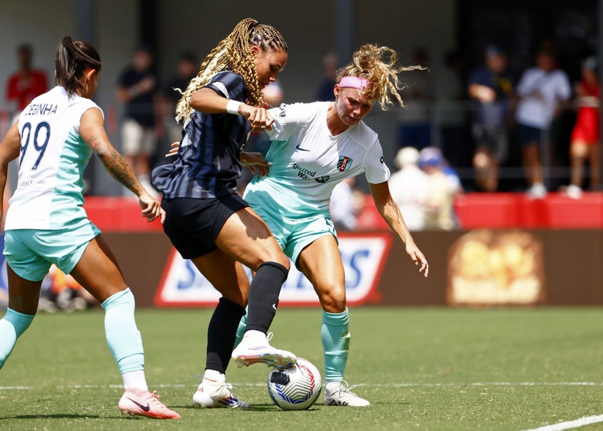 Aug 25, 2024; Washington, District of Columbia, USA; Washington Spirit forward Trinity Rodman (2) controls the ball against Kansas City Current defender Ellie Wheeler (5) during the first half at Audi Field. Mandatory Credit: Amber Searls-USA TODAY Sports