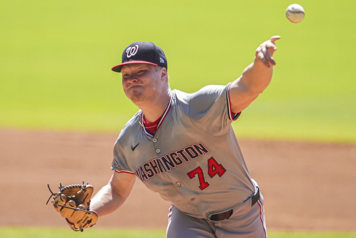 Aug 25, 2024; Cumberland, Georgia, USA; Washington Nationals starting pitcher DJ Herz (74) pitches against the Atlanta Braves during the first inning at Truist Park. Mandatory Credit: Dale Zanine-USA TODAY Sports
