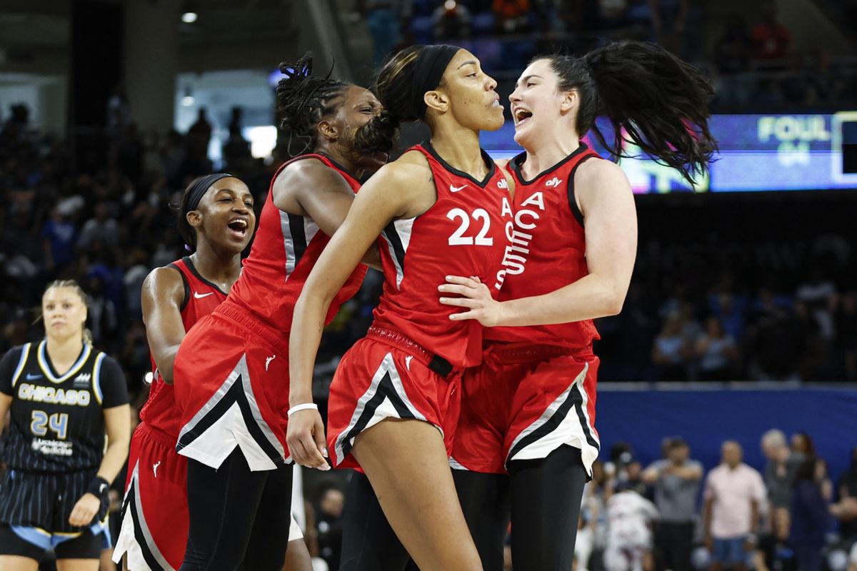 Aug 25, 2024; Chicago, Illinois, USA; Las Vegas Aces center A'ja Wilson (22) celebrates with teammates after scoring game winning basket against the Chicago Sky during the second half at Wintrust Arena. Mandatory Credit: Kamil Krzaczynski-Imagn Images