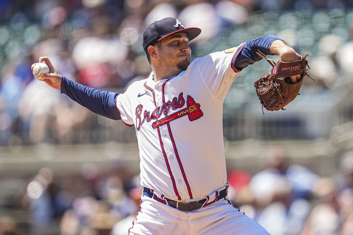 Aug 25, 2024; Cumberland, Georgia, USA; Atlanta Braves relief pitcher Luke Jackson (22) pitches against the Washington Nationals during the seventh inning at Truist Park. Mandatory Credit: Dale Zanine-Imagn Images