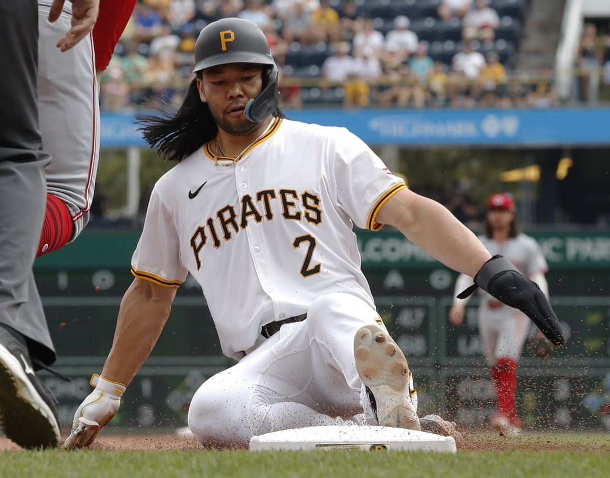 Aug 25, 2024; Pittsburgh, Pennsylvania, USA;  Pittsburgh Pirates designated hitter Connor Joe (2) advances to third base against the Cincinnati Reds during the sixth inning at PNC Park. Mandatory Credit: Charles LeClaire-Imagn Images