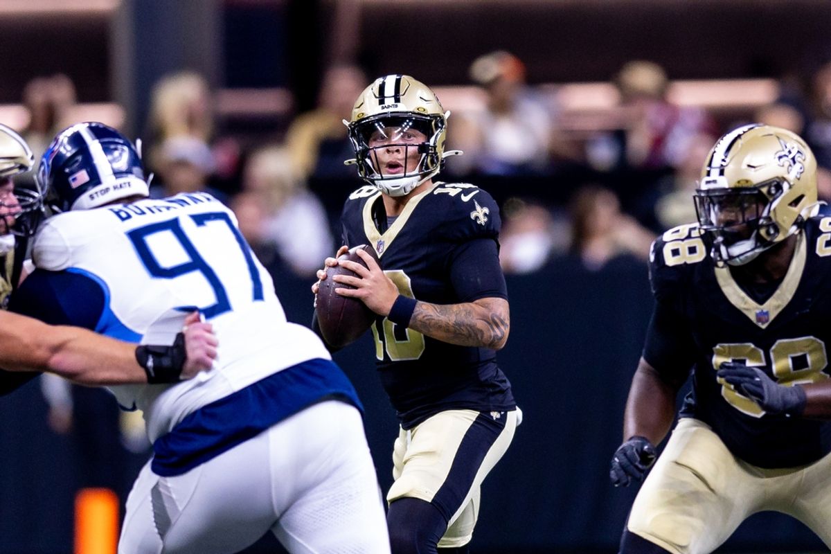 Aug 25, 2024; New Orleans, Louisiana, USA;  New Orleans Saints quarterback Spencer Rattler (18) looks downfield to pass against the Tennessee Titans during the second half at Caesars Superdome. Mandatory Credit: Stephen Lew-Imagn Images
