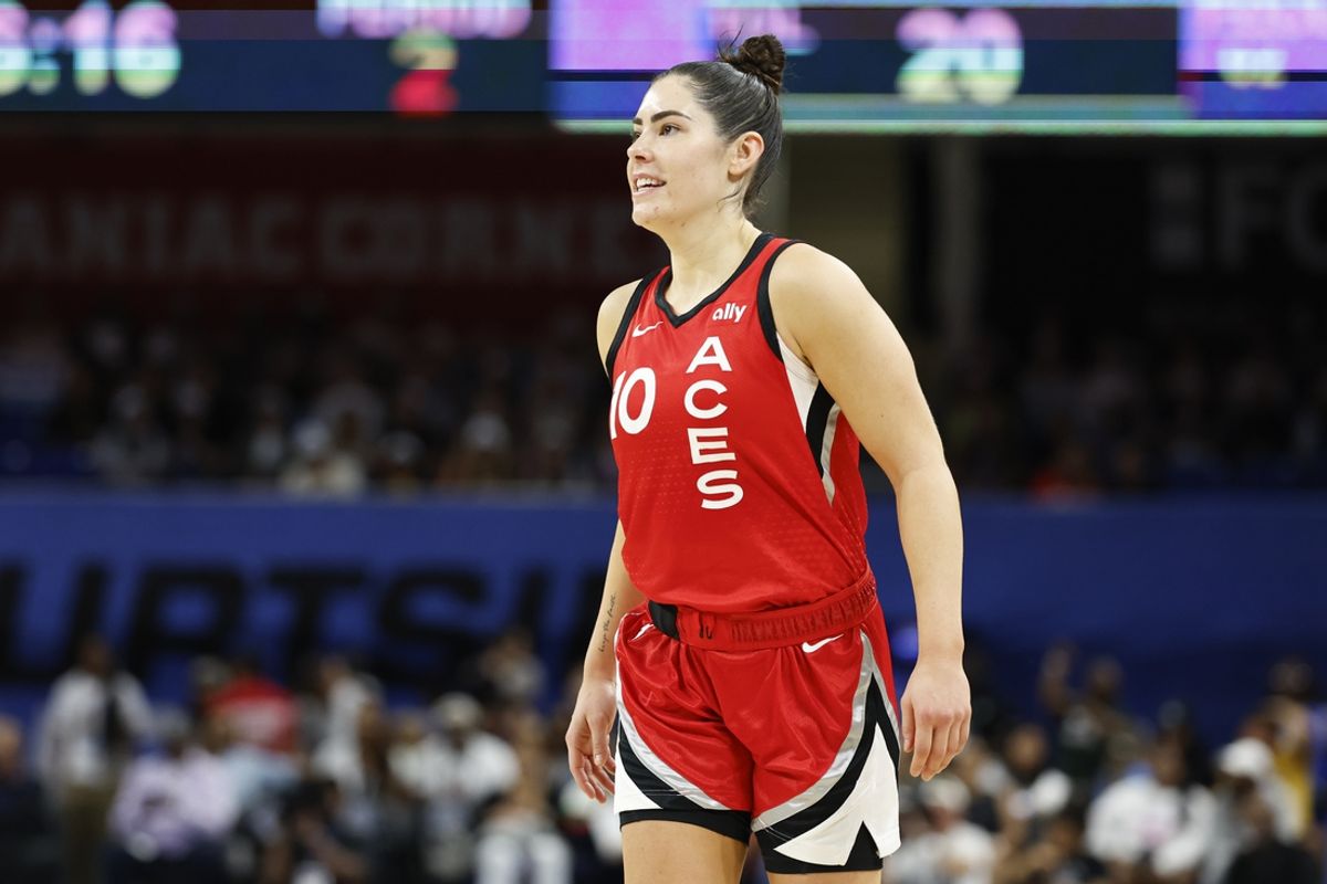 Aug 25, 2024; Chicago, Illinois, USA; Las Vegas Aces guard Kelsey Plum (10) smiles during the first half of a basketball game against the Chicago Sky at Wintrust Arena. Mandatory Credit: Kamil Krzaczynski-Imagn Images