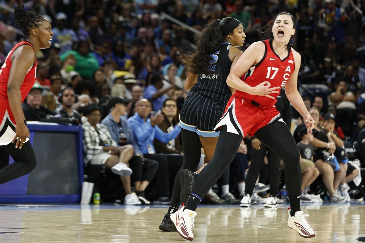 Aug 25, 2024; Chicago, Illinois, USA; Las Vegas Aces center Megan Gustafson (17) celebrates after scoring against the Chicago Sky during the second half at Wintrust Arena. Mandatory Credit: Kamil Krzaczynski-Imagn Images