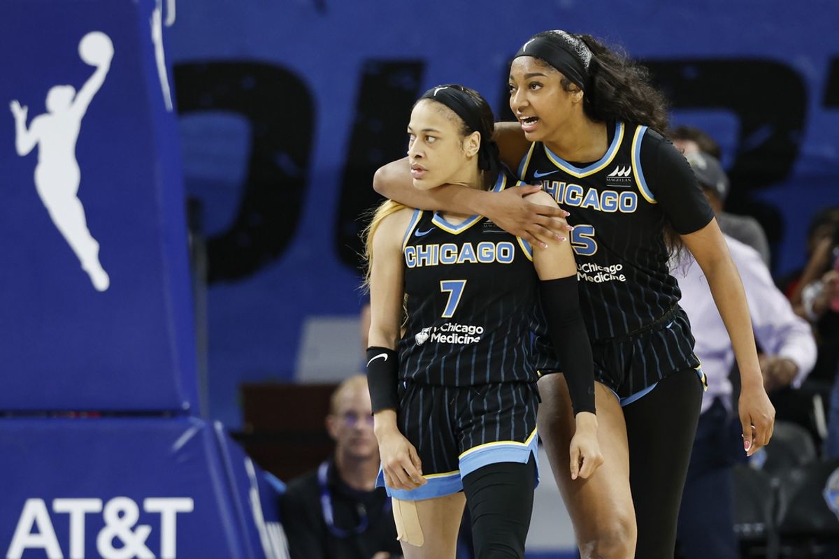 Aug 25, 2024; Chicago, Illinois, USA; Chicago Sky guard Chennedy Carter (7) reacts next to forward Angel Reese (5) after scoring against the Las Vegas Aces during the second half at Wintrust Arena. Mandatory Credit: Kamil Krzaczynski-USA TODAY Sports