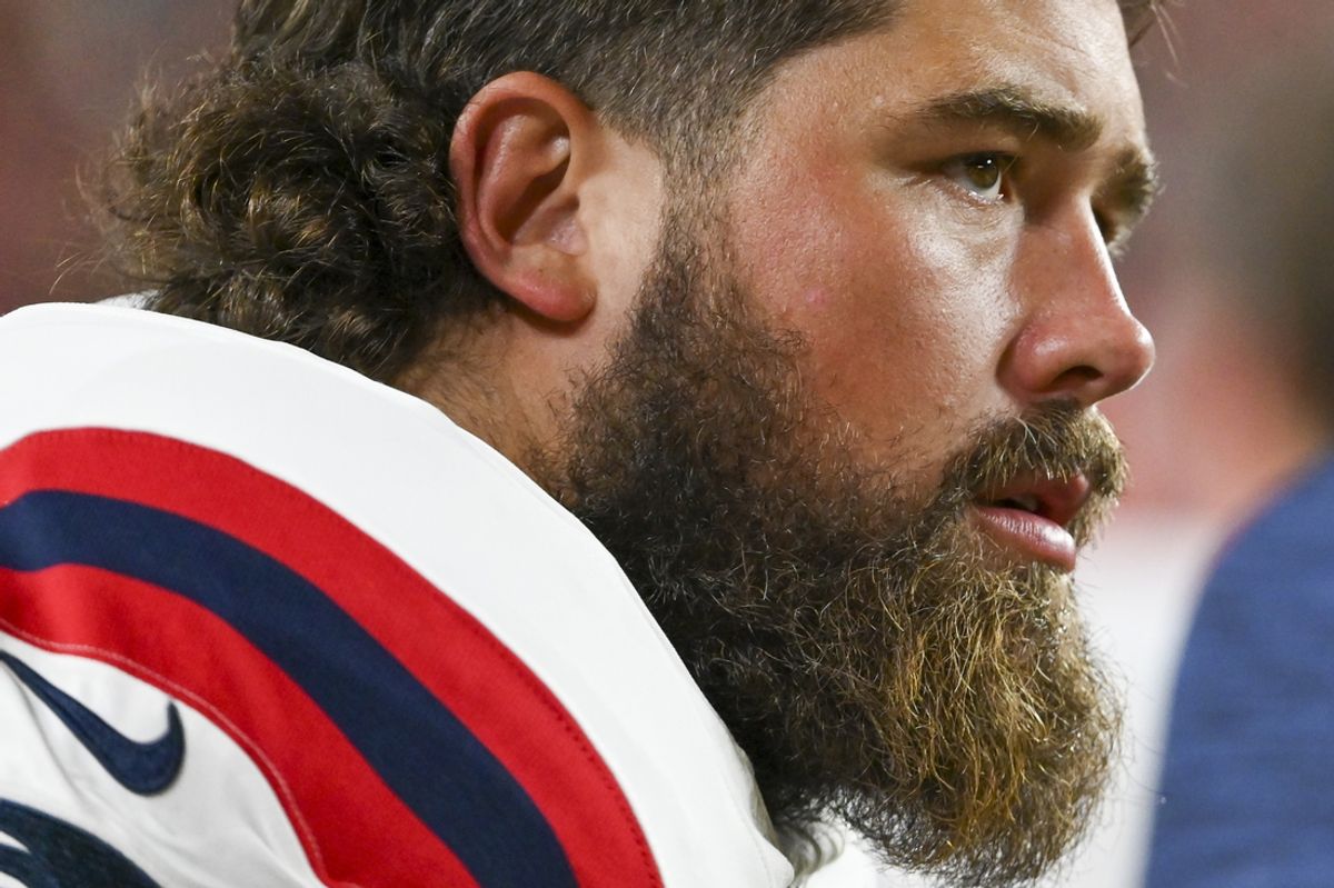 Aug 25, 2024; Landover, Maryland, USA;  New England Patriots center David Andrews (60) looks onto the field during the second  half against the Washington Commanders at Commanders Field. Mandatory Credit: Tommy Gilligan-Imagn Images