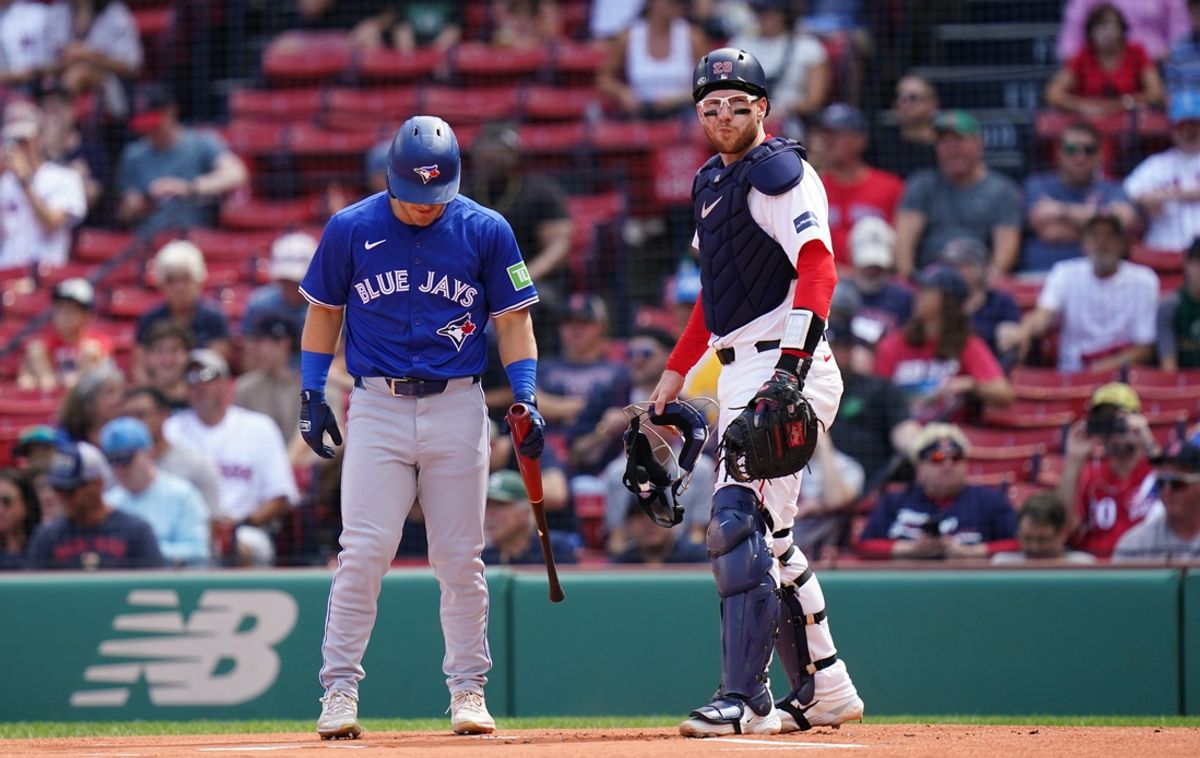 Aug 26, 2024; Boston, Massachusetts, USA; Boston Red Sox catcher Danny Jansen (28) at home plate with Toronto Blue Jays center fielder Daulton Varsho (25) pinch hitting for Jenson making history in the second inning at Fenway Park. Mandatory Credit: David Butler II-USA TODAY Sports