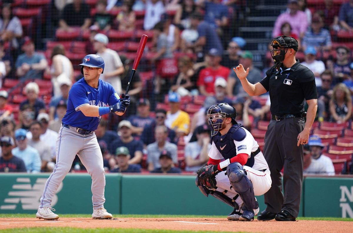 Aug 26, 2024; Boston, Massachusetts, USA; Boston Red Sox catcher Danny Jansen (28) at home plate with Toronto Blue Jays center fielder Daulton Varsho (25) pinch hitting for Jenson making history in the second inning at Fenway Park. Mandatory Credit: David Butler II-USA TODAY Sports