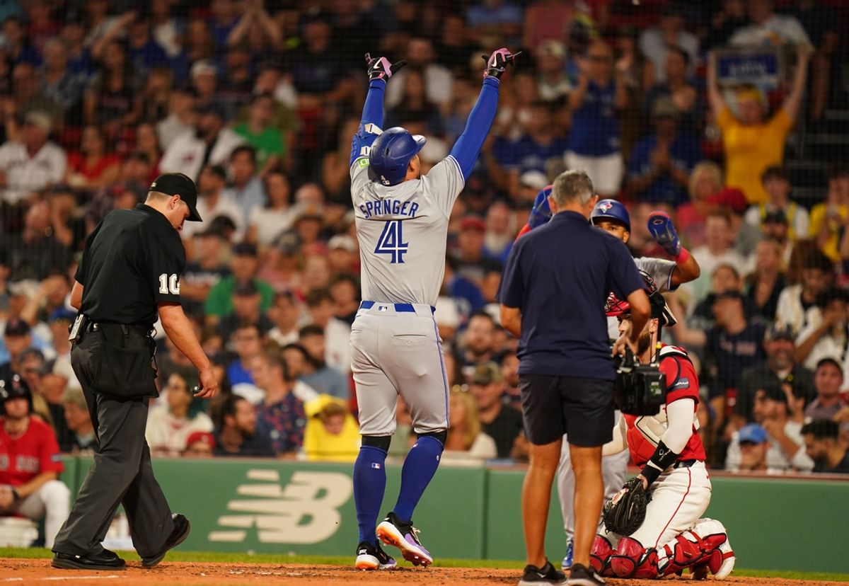 Aug 26, 2024; Boston, Massachusetts, USA; Toronto Blue Jays right fielder George Springer (4) hits a three run home run against the Boston Red Sox in the fifth inning at Fenway Park. Mandatory Credit: David Butler II-USA TODAY Sports