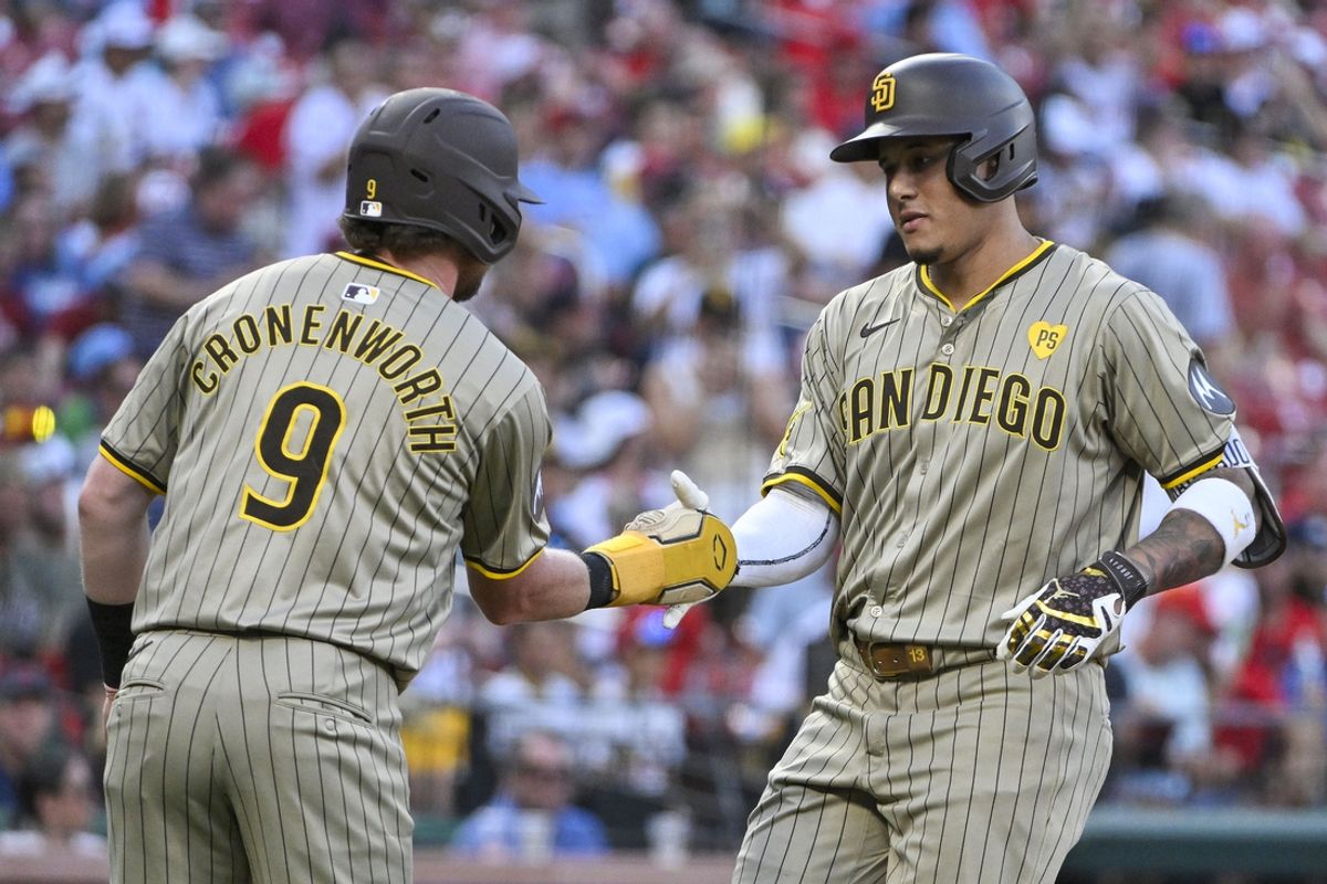 Aug 26, 2024; St. Louis, Missouri, USA;  San Diego Padres third baseman Manny Machado (13) is congratulated by first baseman Jake Cronenworth (9) after hitting a two run home run against the St. Louis Cardinals during the first inning at Busch Stadium. Mandatory Credit: Jeff Curry-USA TODAY Sports