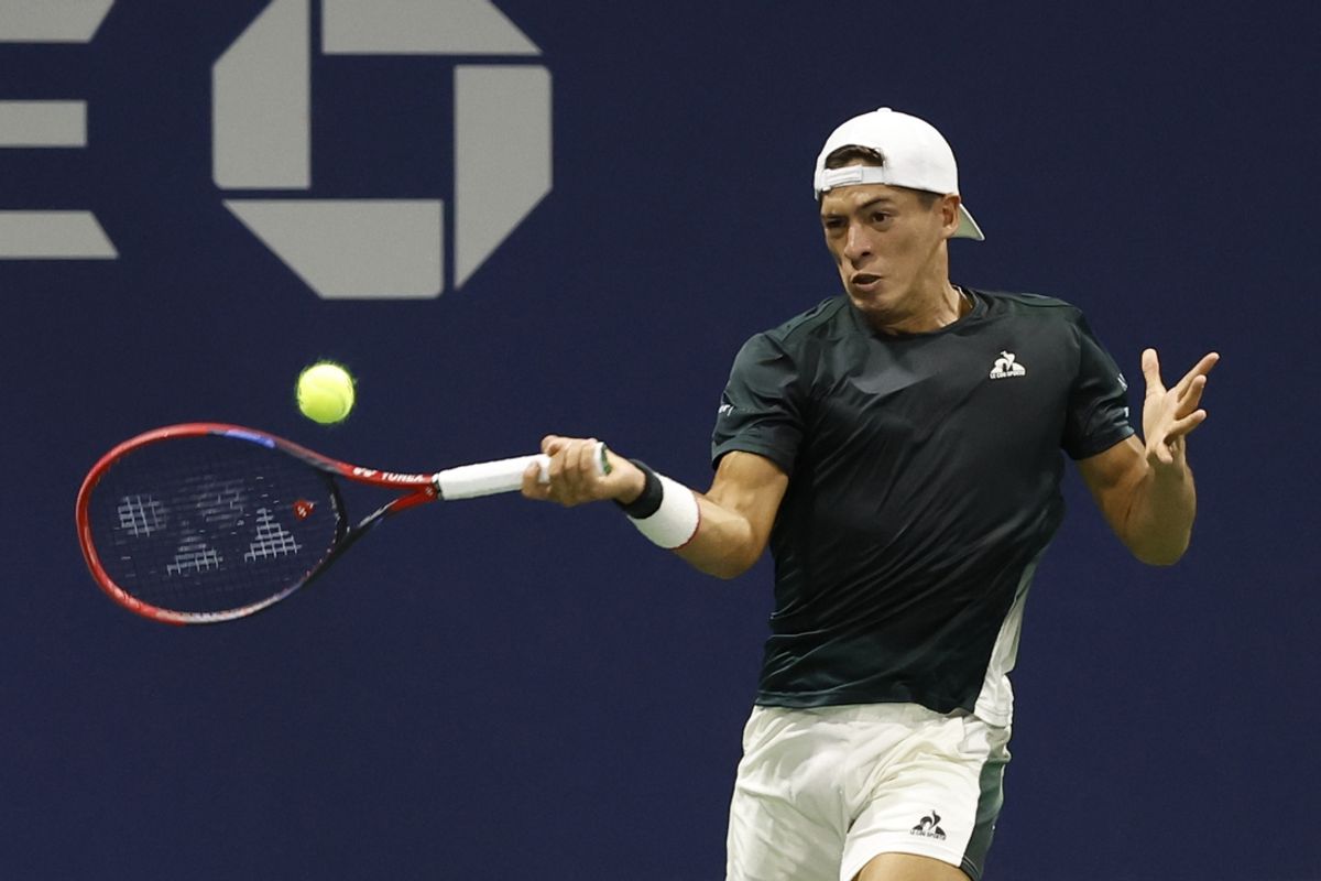 Aug 26, 2024; Flushing, NY, USA; Sebastian Baez (ARG) hits a forehand against Luciano Darderi (ITA)(not pictured) in a men's singles match on day one of the 2024 U.S. Open tennis tournament at USTA Billie Jean King National Tennis Center. Mandatory Credit: Geoff Burke-Imagn Images