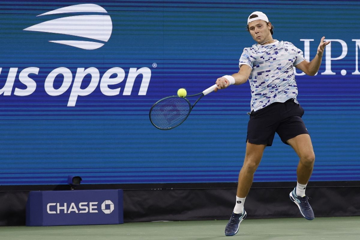 Aug 26, 2024; Flushing, NY, USA; Aleksandar Kovacevic (USA) hits a forehand against Frances Tiafoe (USA)(not pictured) in a men's singles match on day one of the 2024 U.S. Open tennis tournament at USTA Billie Jean King National Tennis Center.. Mandatory Credit: Geoff Burke-Imagn Images