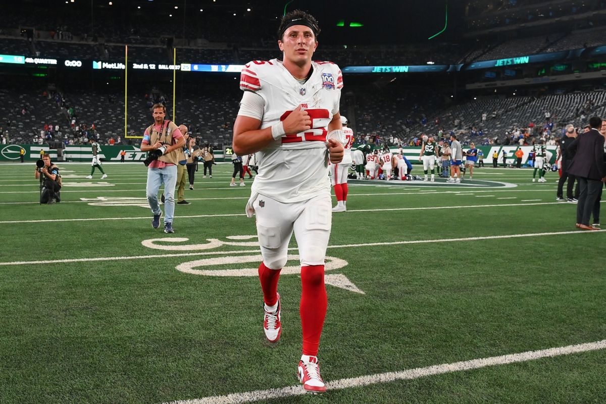 Aug 24, 2024; East Rutherford, New Jersey, USA; New York Giants quarterback Tommy DeVito (15) jogs off the field following the game against the New York Jets at MetLife Stadium. Mandatory Credit: Rich Barnes-Imagn Images