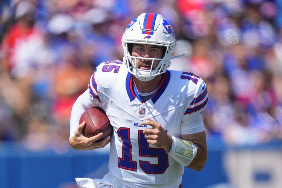 Aug 24, 2024; Orchard Park, New York, USA; Buffalo Bills quarterback Ben DiNucci (15) runs with the ball against the Carolina Panthers during the first half at Highmark Stadium. Mandatory Credit: Gregory Fisher-Imagn Images