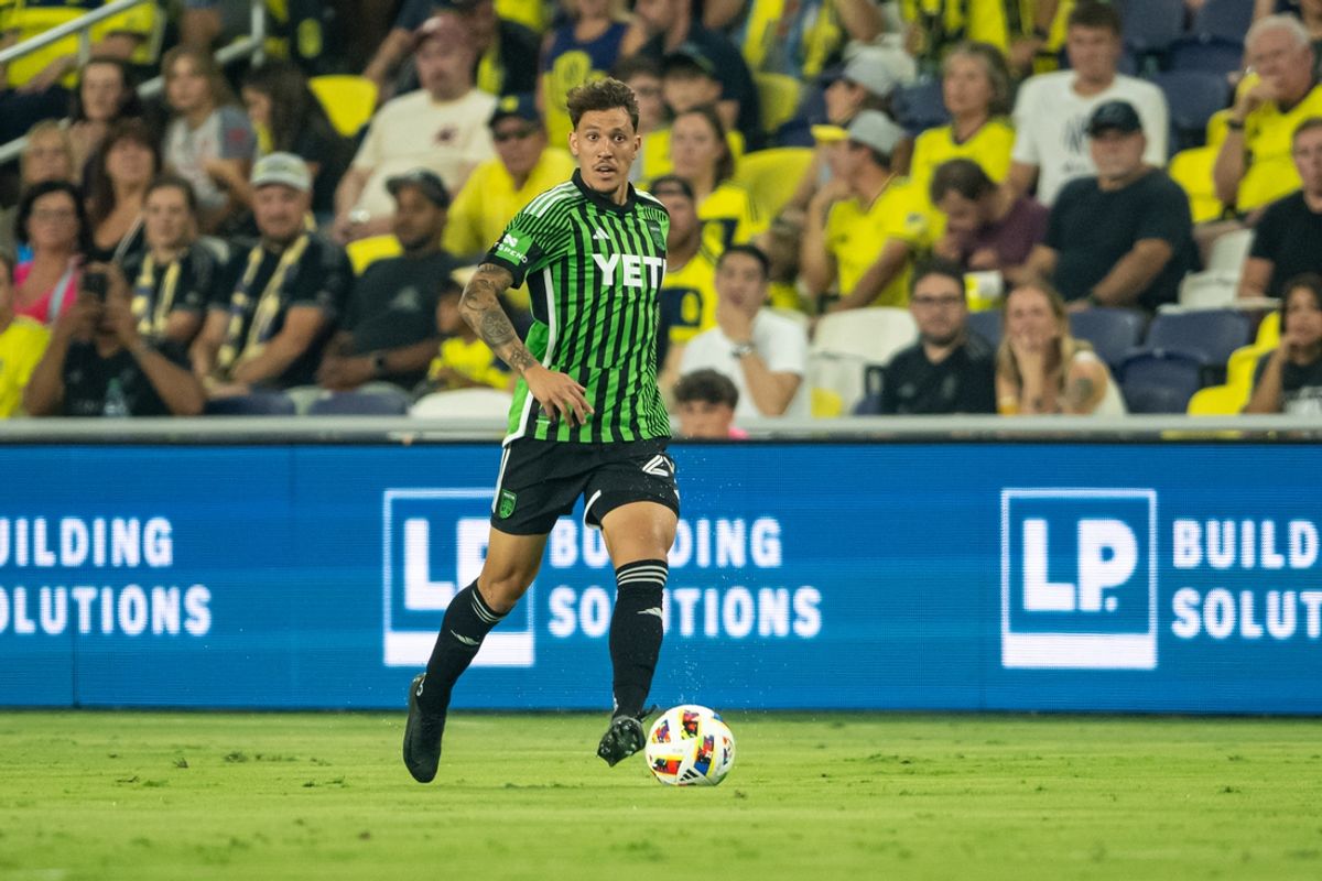 Aug 24, 2024; Nashville, Tennessee, USA;  Austin FC defender Brendan Hines-Ike (4) dribbles the ball against the Nashville SC during the first half at Geodis Park. Mandatory Credit: Steve Roberts-Imagn Images