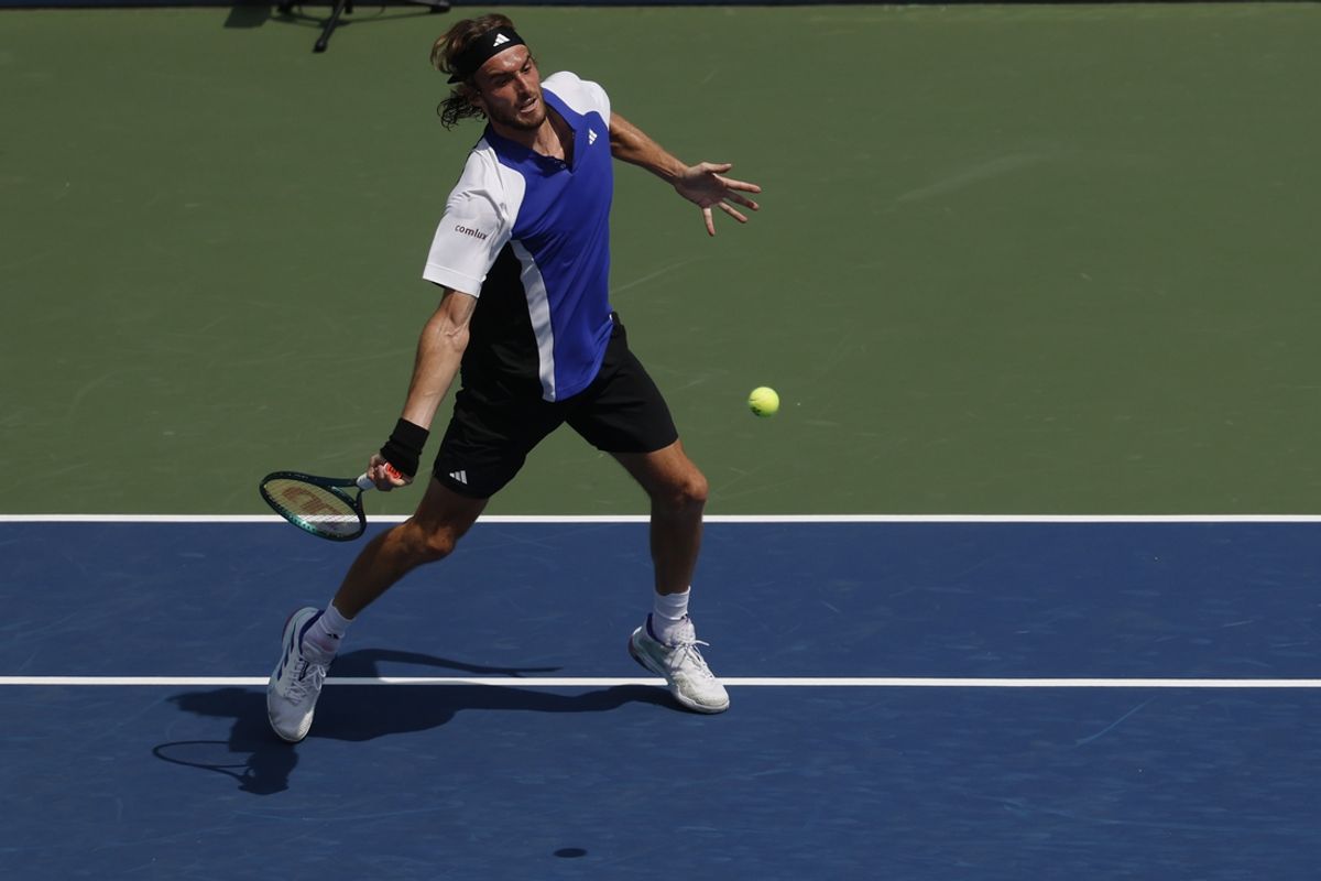 Aug 27, 2024; Flushing, NY, USA; Stefanos Tsitsipas (GRE) hits a forehand against Thanasi Kokkinakis (AUS)(not pictured) in a men's singles match on day two of the 2024 U.S. Open tennis tournament at USTA Billie Jean King National Tennis Center. Mandatory Credit: Geoff Burke-Imagn Images