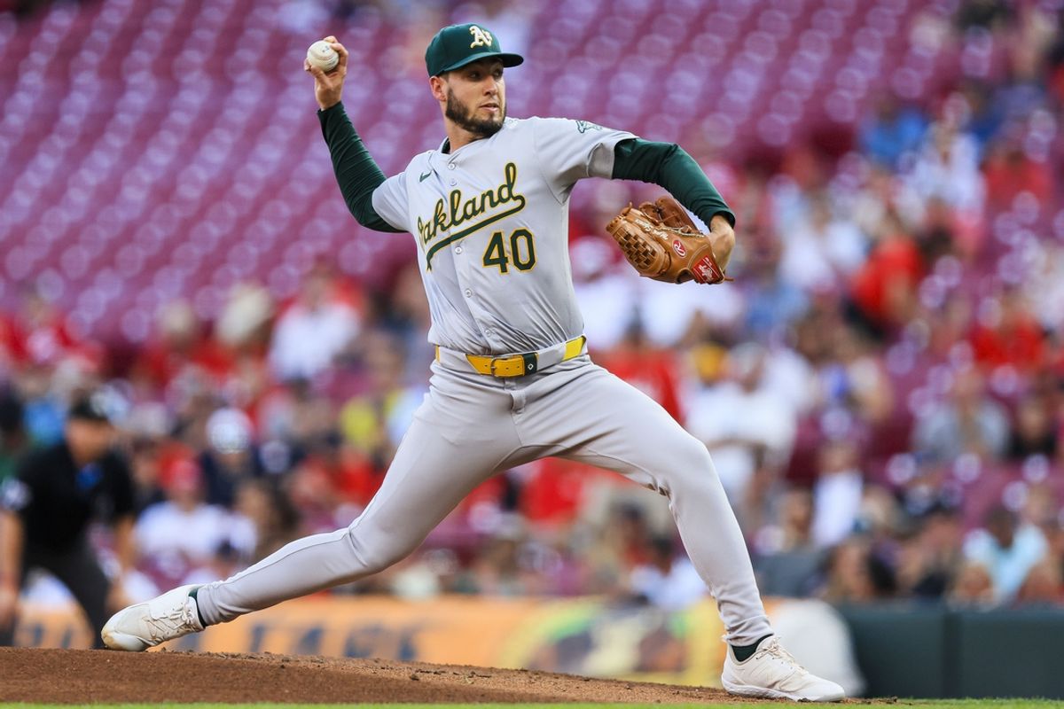 Aug 27, 2024; Cincinnati, Ohio, USA; Oakland Athletics starting pitcher Mitch Spence (40) pitches against the Cincinnati Reds in the first inning at Great American Ball Park. Mandatory Credit: Katie Stratman-USA TODAY Sports