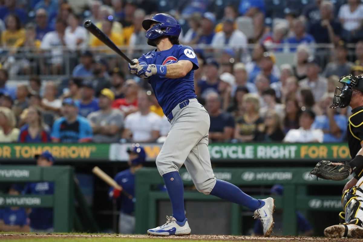 Aug 27, 2024; Pittsburgh, Pennsylvania, USA;  Chicago Cubs shortstop Dansby Swanson (7) hits a two run home run against he Pittsburgh Pirates during the fourth inning at PNC Park. Mandatory Credit: Charles LeClaire-USA TODAY Sports