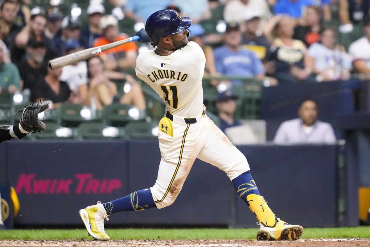 Aug 27, 2024; Milwaukee, Wisconsin, USA;  Milwaukee Brewers left fielder Jackson Chourio (11) hits a home run during the third inning against the San Francisco Giants at American Family Field. Mandatory Credit: Jeff Hanisch-USA TODAY Sports