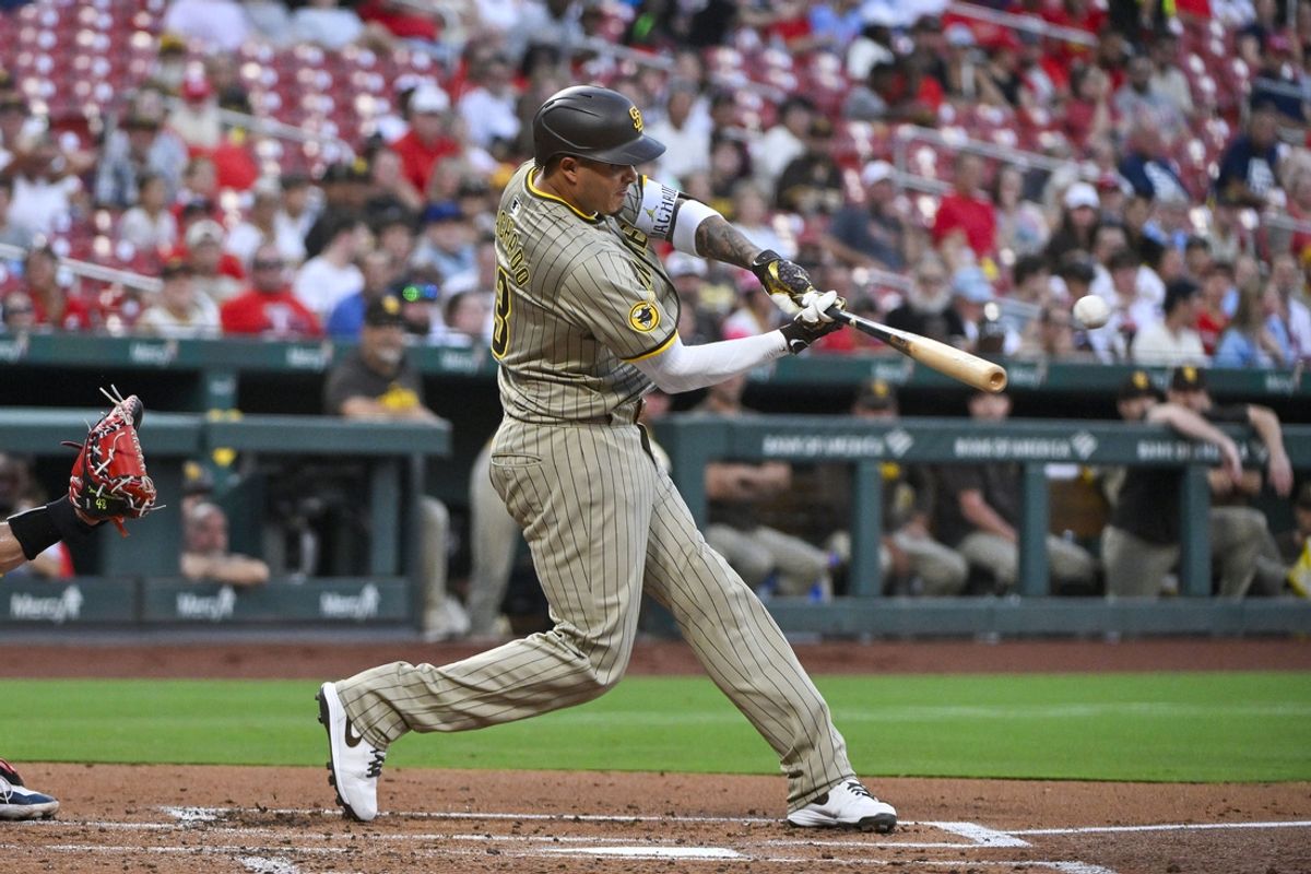 Aug 27, 2024; St. Louis, Missouri, USA;  San Diego Padres third baseman Manny Machado (13) hits a solo home run against the St. Louis Cardinals during the second inning at Busch Stadium. Mandatory Credit: Jeff Curry-USA TODAY Sports