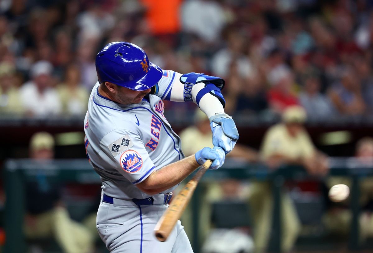 Aug 27, 2024; Phoenix, Arizona, USA; New York Mets first baseman Pete Alonso hits a solo home run in the second inning against the Arizona Diamondbacks at Chase Field. Mandatory Credit: Mark J. Rebilas-USA TODAY Sports