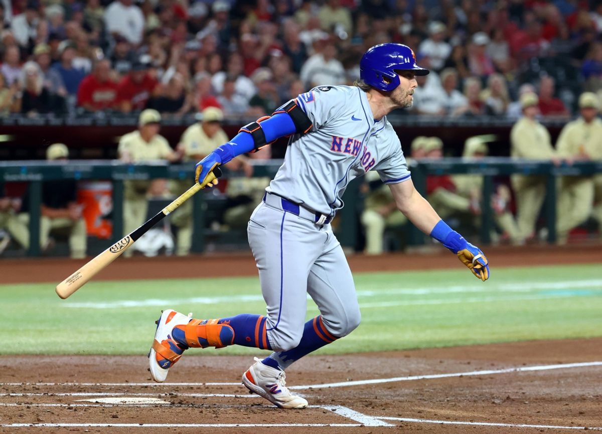 Aug 27, 2024; Phoenix, Arizona, USA; New York Mets infielder Jeff McNeil drives in a run in the second inning against the Arizona Diamondbacks at Chase Field. Mandatory Credit: Mark J. Rebilas-Imagn Images