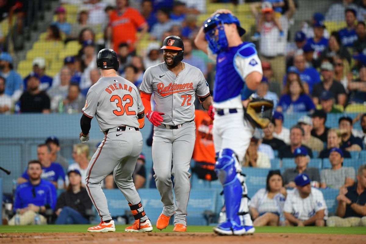 Aug 27, 2024; Los Angeles, California, USA; Baltimore Orioles first baseman Ryan O'Hearn (32) is greeted by designated hitter Eloy Jimenez (72) after hitting a solo home run against the Los Angeles Dodgers during the second inning at Dodger Stadium. Mandatory Credit: Gary A. Vasquez-USA TODAY Sports