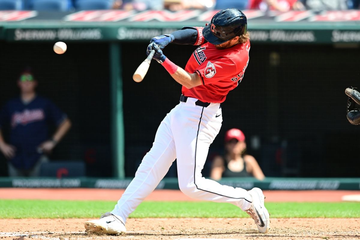 Aug 28, 2024; Cleveland, Ohio, USA; Cleveland Guardians shortstop Daniel Schneemann (10) hits a single during the fifth inning against the Kansas City Royals at Progressive Field. Mandatory Credit: Ken Blaze-USA TODAY Sports