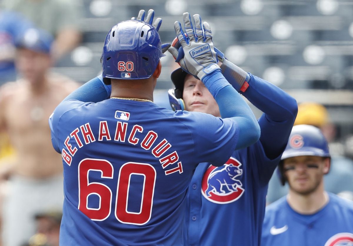 Aug 28, 2024; Pittsburgh, Pennsylvania, USA;  Chicago Cubs center tfielder Pete Crow-Armstrong (rear) greets catcher Christian Bethancourt (60) crossing home plate on a two run home run against the Pittsburgh Pirates during the seventh inning at PNC Park. Mandatory Credit: Charles LeClaire-USA TODAY Sports