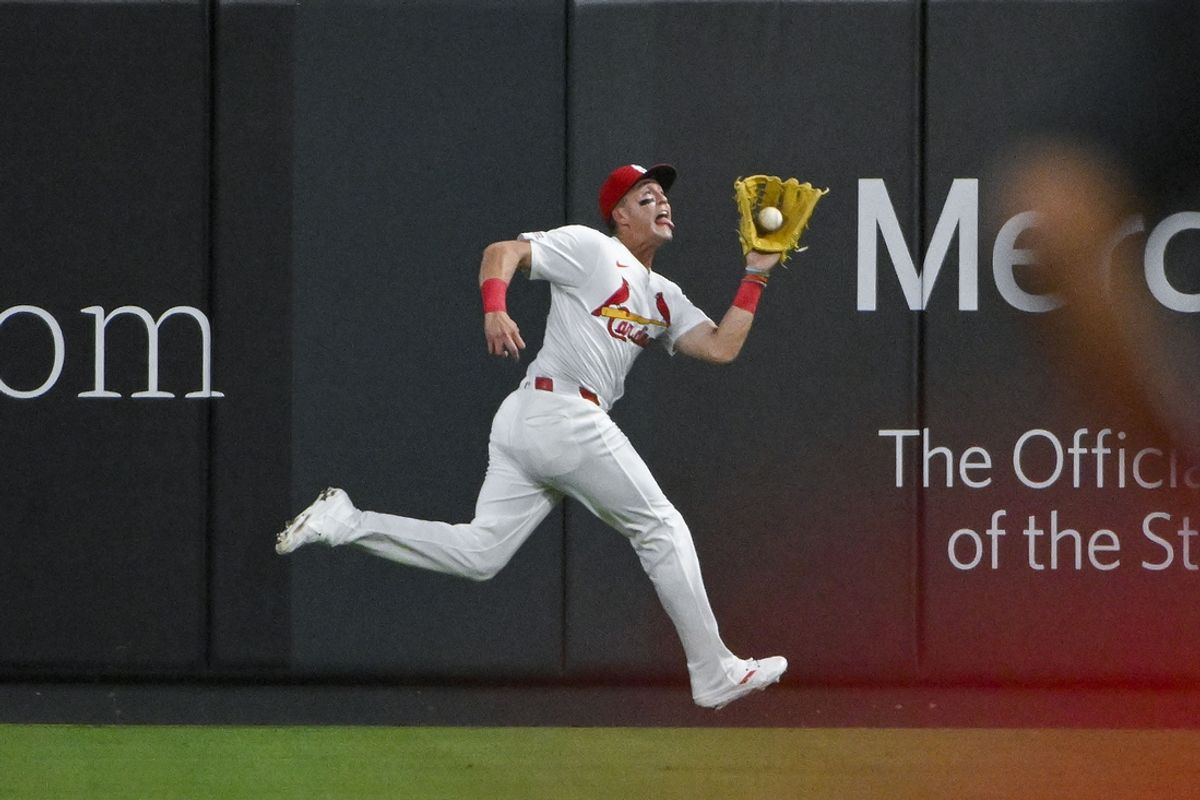 Aug 28, 2024; St. Louis, Missouri, USA;  St. Louis Cardinals center fielder Lars Nootbaar (21) catches a fly ball against the San Diego Padres during the fourth inning at Busch Stadium. Mandatory Credit: Jeff Curry-USA TODAY Sports