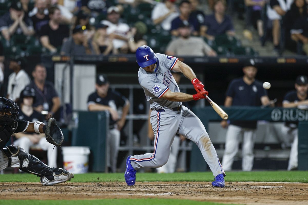 Aug 28, 2024; Chicago, Illinois, USA; Texas Rangers outfielder Wyatt Langford (36) hits a three-run home run against the Chicago White Sox during the fourth inning of game two of the doubleheader at Guaranteed Rate Field. Mandatory Credit: Kamil Krzaczynski-USA TODAY Sports