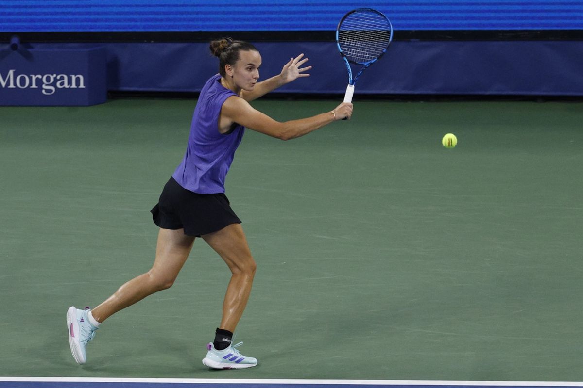 Aug 28, 2024; Flushing, NY, USA; Clara Burel (FRA) hits a backhand against Victoria Azarenka (not pictured) in a women's singles match on day three of the U.S. Open tennis tournament at USTA Billie Jean King National Tennis Center. Mandatory Credit: Geoff Burke-Imagn Images