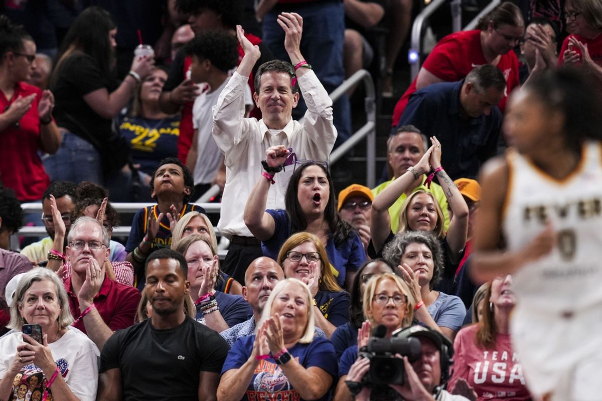 Aug 28, 2024; Indianapolis, Indiana, USA; Fans cheer for Indiana Fever guard Kelsey Mitchell (0) during a game between the Indiana Fever and the Connecticut Sun at Gainbridge Fieldhouse. Mandatory Credit: Grace Smith-INDIANAPOLIS STAR-USA TODAY Sports