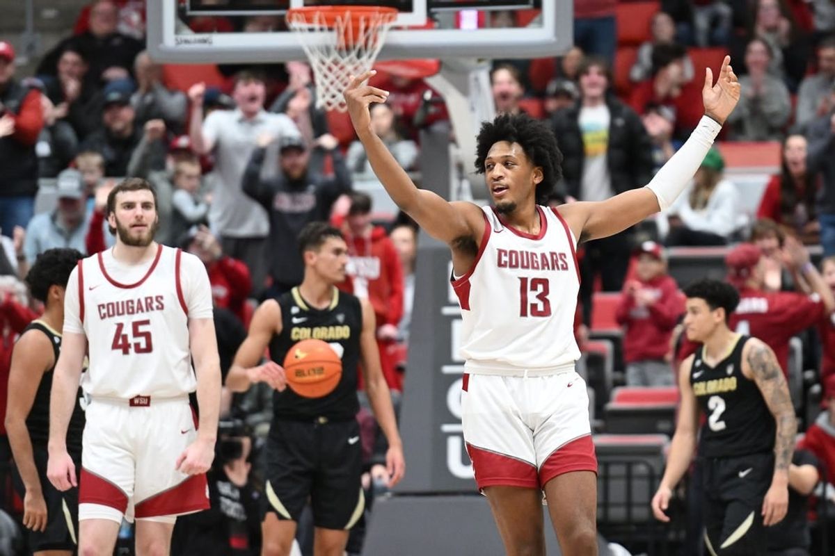 Jan 27, 2024; Pullman, Washington, USA; Washington State Cougars forward Isaac Jones (13) celebrates after a play against the Colorado Buffaloes in the second half at Friel Court at Beasley Coliseum. Washington State won 78-69.
