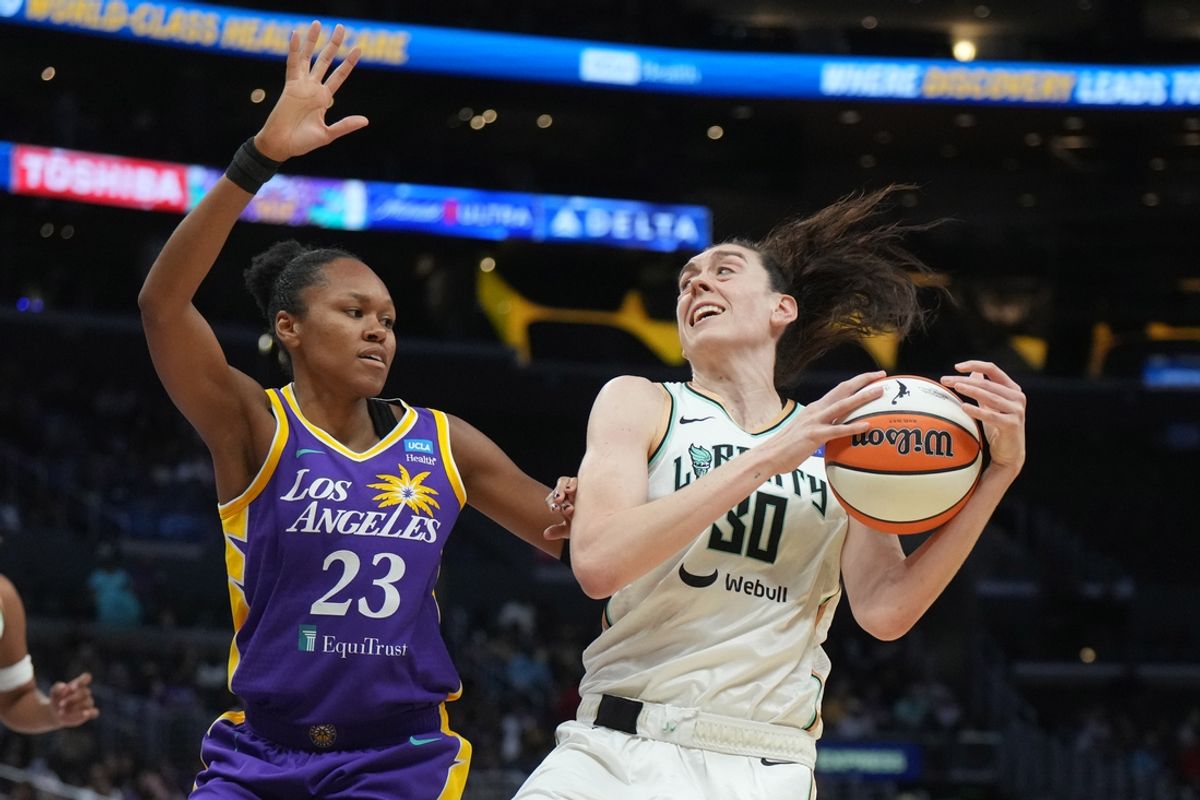 Aug 28, 2024; Los Angeles, California, USA; New York Liberty forward Breanna Stewart (30) is defended by LA Sparks forward Azura Stevens (23) in the first half at Crypto.com Arena. Mandatory Credit: Kirby Lee-USA TODAY Sports