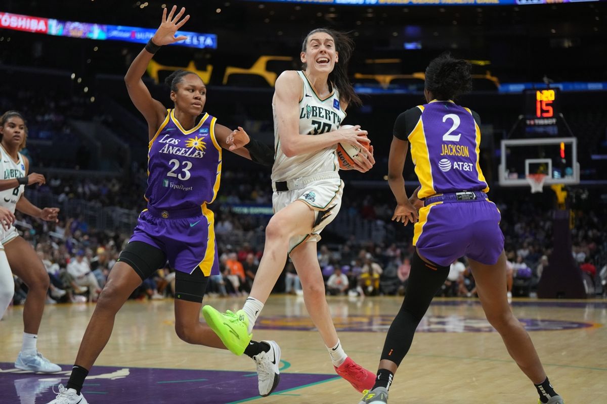 Aug 28, 2024; Los Angeles, California, USA; New York Liberty forward Breanna Stewart (30) is defended by LA Sparks forward Azura Stevens (23) and forward Rickea Jackson (2) in the first half at Crypto.com Arena. Mandatory Credit: Kirby Lee-Imagn Images