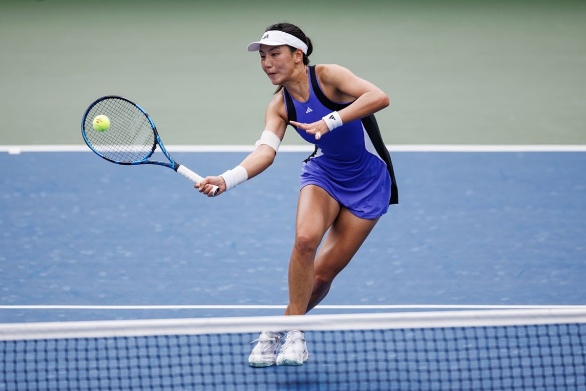 Aug 29, 2024; Flushing, NY, USA; Xinyu Wang of China in action against Yulia Putintseva of Kazakhstan on day four of the 2024 U.S. Open tennis tournament at the USTA Billie Jean King National Tennis Center. Mandatory Credit: Mike Frey-Imagn Images