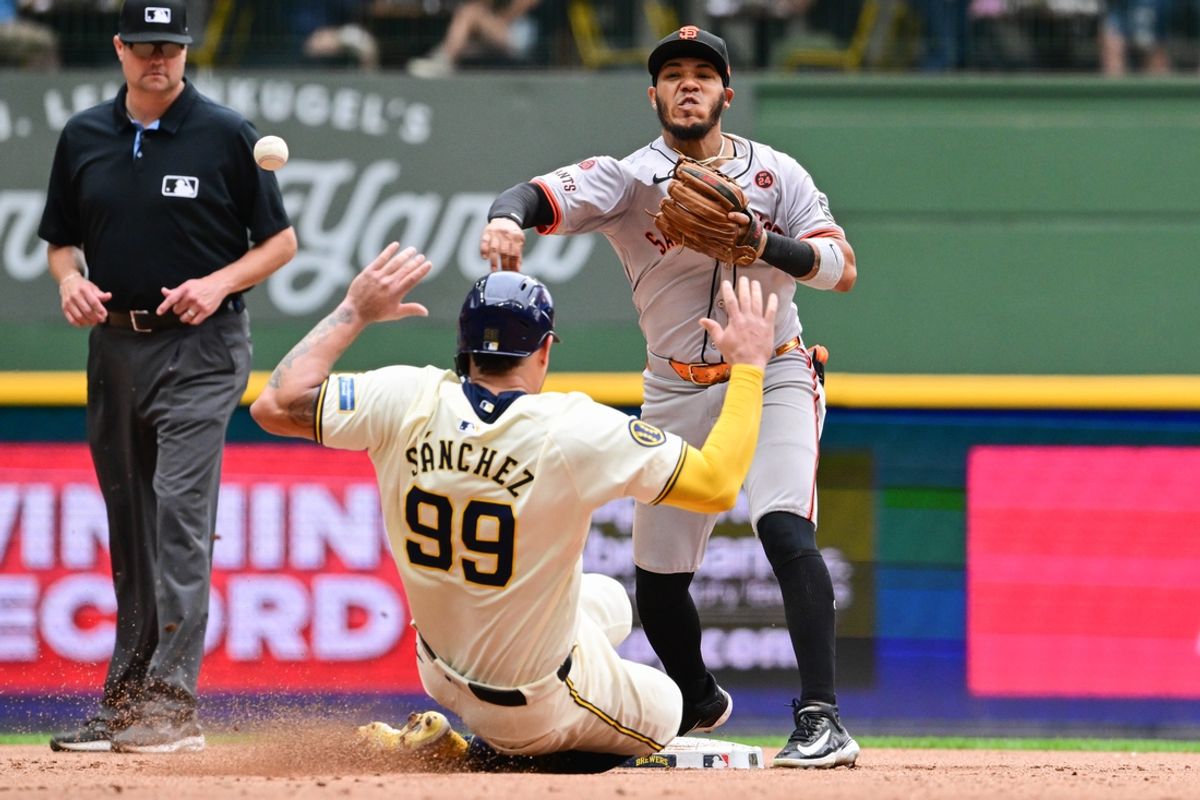 Aug 29, 2024; Milwaukee, Wisconsin, USA; San Francisco Giants second baseman Thairo Estrada (39) completes a double play after forcing out Milwaukee Brewers catcher Gary Sanchez (99) in the seventh inning at American Family Field. Mandatory Credit: Benny Sieu-Imagn Images