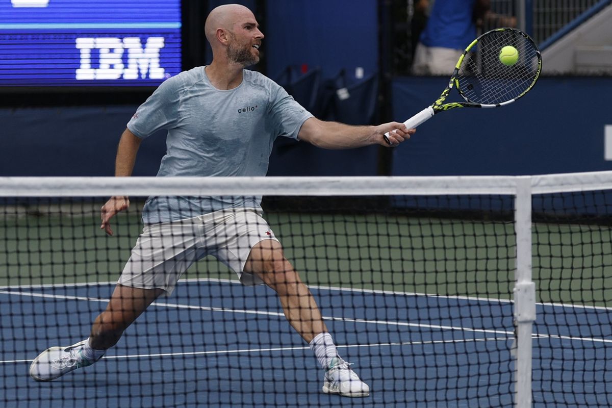 Aug 29, 2024; Flushing, NY, USA; Adrian Mannarino (FRA) hits a volley against David Goffin (BEL)(not pictured) in a men's singles match on day four of the 2024 U.S. Open tennis tournament at Billie Jean King National Tennis Center. Mandatory Credit: Geoff Burke-Imagn Images