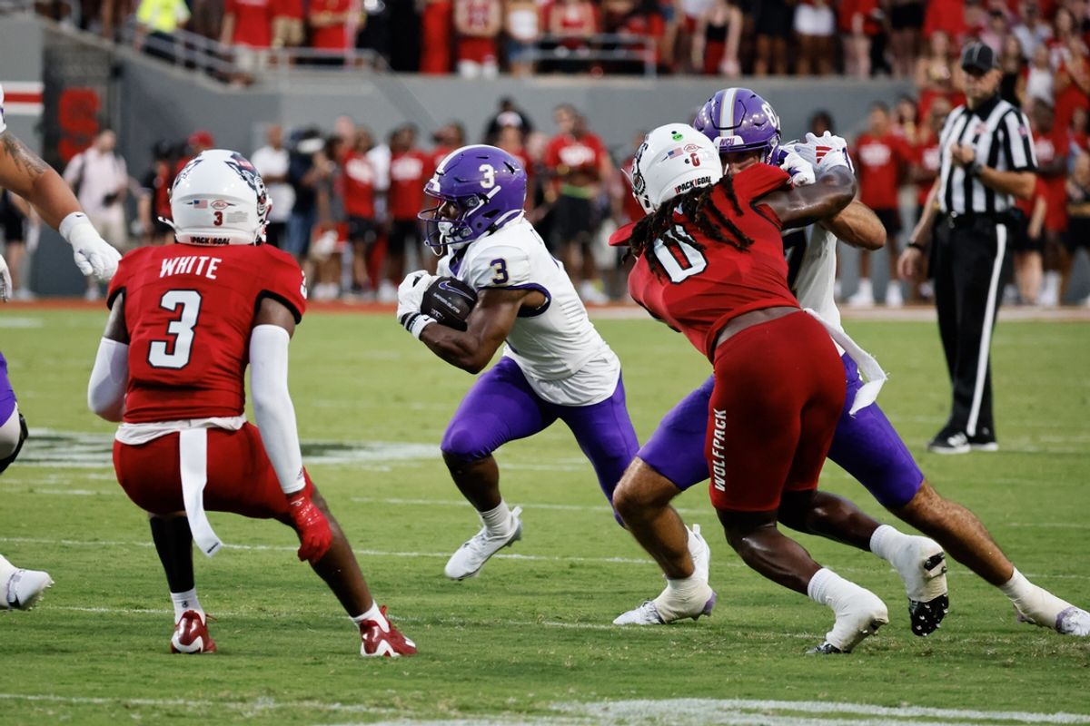 Aug 29, 2024; Raleigh, North Carolina, USA;  Western Carolina Catamounts wide receiver Calvin Jones (3) runs with the football during the first half of the game against North Carolina State Wolfpack at Carter-Finley Stadium. Mandatory Credit: Jaylynn Nash-USA TODAY Sports