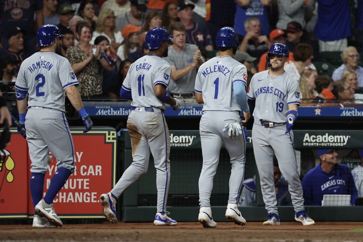Aug 29, 2024; Houston, Texas, USA; Kansas City Royals second baseman Michael Massey (19) celebrates left fielder MJ Melendez (1) and  third baseman Maikel Garcia (11) scoring agains the Houston Astros in the seventh inning at Minute Maid Park. Mandatory Credit: Thomas Shea-Imagn Images