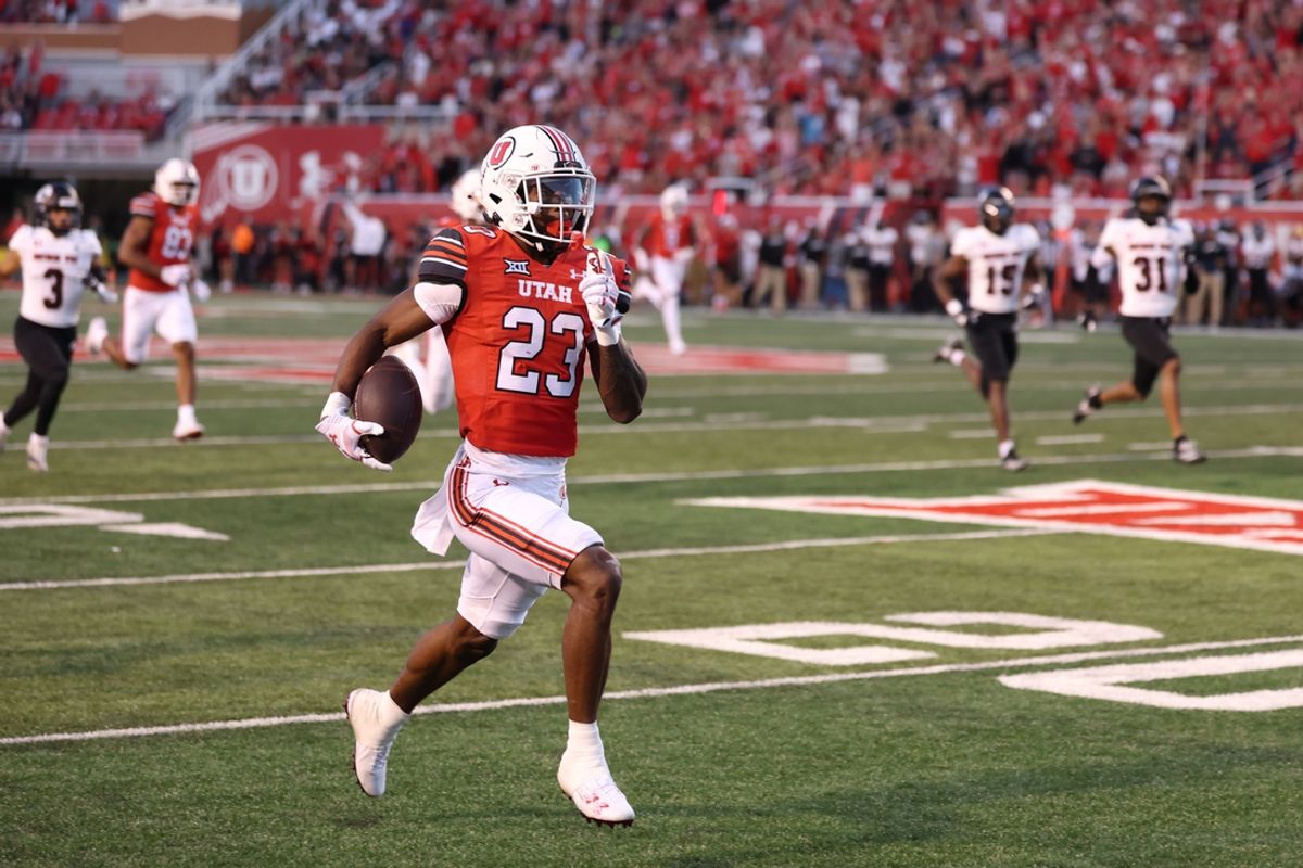 Aug 29, 2024; Salt Lake City, Utah, USA; Utah Utes running back Dijon Stanley (23) runs for a touchdown after a catch against the Southern Utah Thunderbirds during the second quarter at Rice-Eccles Stadium. Mandatory Credit: Rob Gray-USA TODAY Sports