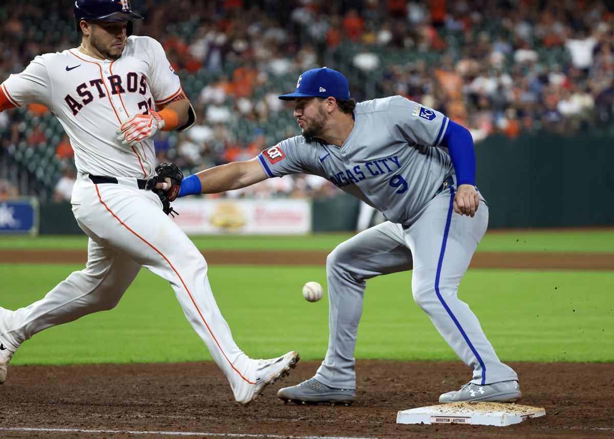 Aug 29, 2024; Houston, Texas, USA;  Houston Astros catcher Yainer Diaz (21) collides with Kansas City Royals first baseman Vinnie Pasquantino (9) in the eighth inning at Minute Maid Park. Mandatory Credit: Thomas Shea-USA TODAY Sports