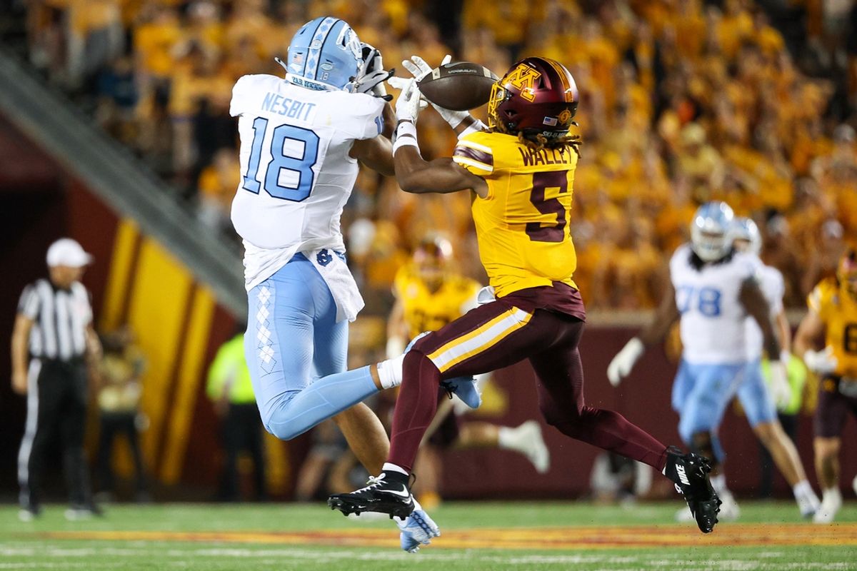 Aug 29, 2024; Minneapolis, Minnesota, USA; Minnesota Golden Gophers defensive back Justin Walley (5) intercepts a pass intended for North Carolina Tar Heels tight end Bryson Nesbit (18) during the first half at Huntington Bank Stadium. Mandatory Credit: Matt Krohn-USA TODAY Sports