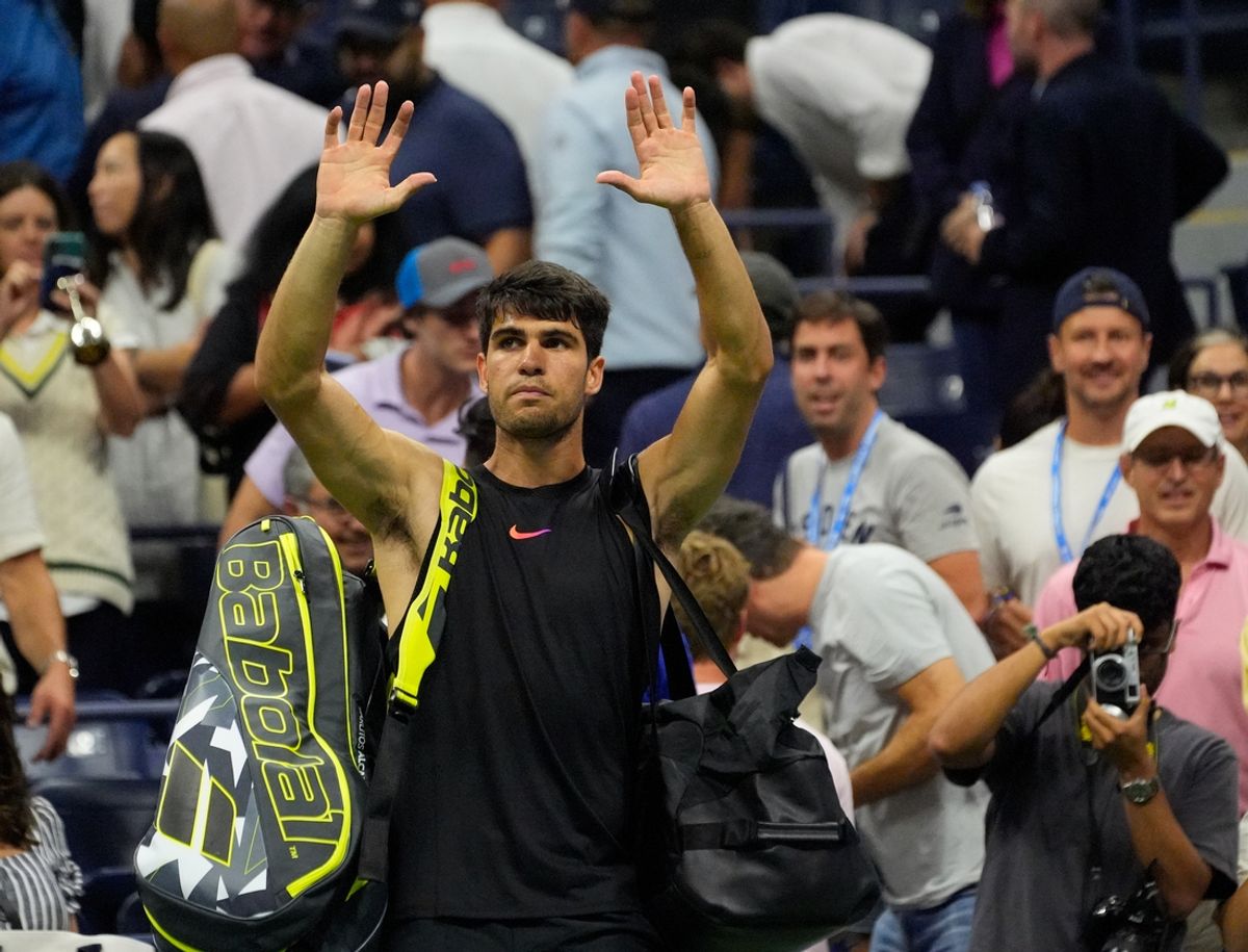 Aug 29, 2024; Flushing, NY, USA;  Carlos Alcaraz of Spain after losing to Botic van De Zandschulp of the Netherlands on day four of the 2024 U.S. Open tennis tournament at USTA Billie Jean King National Tennis Center. Mandatory Credit: Robert Deutsch-Imagn Images