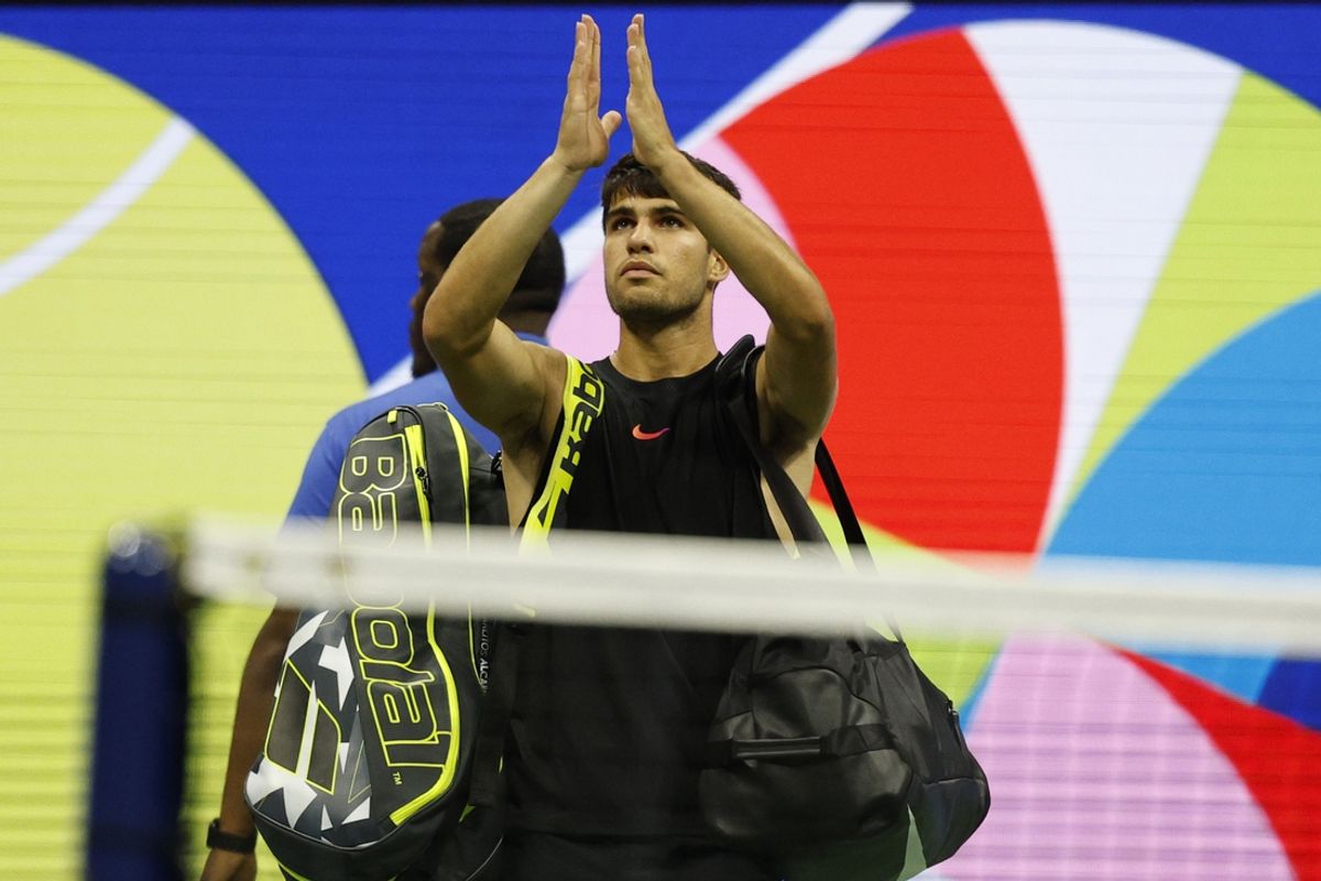 Aug 29, 2024; Flushing, NY, USA; Carlos Alcaraz (ESP) waves to the crowd while leaving the court after his match against Botic van De Zandschlup (NED)(not pictured) in a men's singles match on day four of the 2024 U.S. Open tennis tournament at Billie Jean King National Tennis Center. Mandatory Credit: Geoff Burke-Imagn Images
