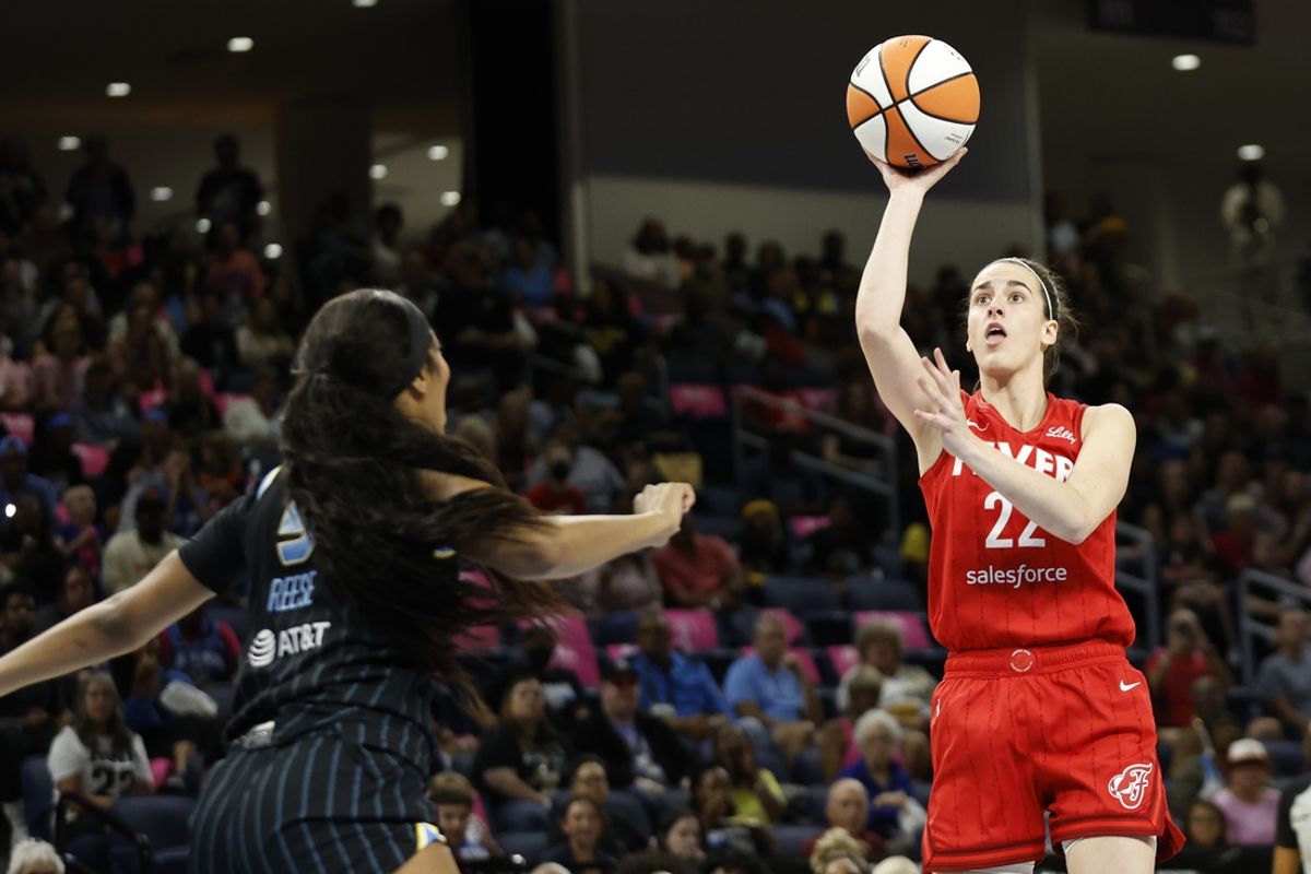 Aug 30, 2024; Chicago, Illinois, USA; Indiana Fever guard Caitlin Clark (22) shoots against Chicago Sky forward Angel Reese (5) during the first half at Wintrust Arena. Mandatory Credit: Kamil Krzaczynski-Imagn Images